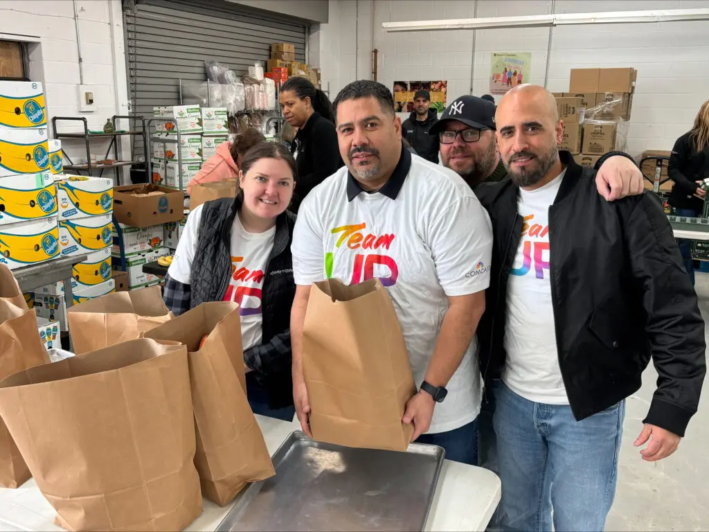 Team Up volunteers bagging up food donations.