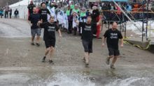 Team Xfinity participants run in a competition