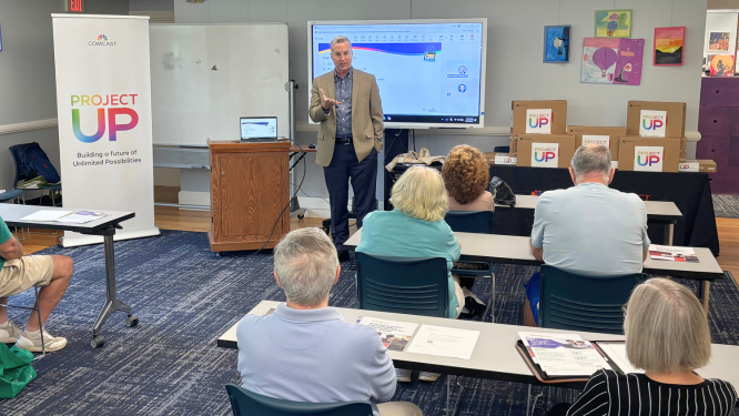 Dan Glanville of Comcast speaks to Longmeadow seniors